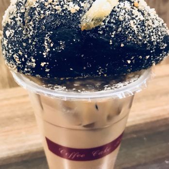 85°C Bakery Cafe-Glendale - Iced coffee with squid ink bacon bread on top - Bakeries Near Me - Glendale, California