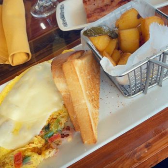 Untoasted - Omelette with white toast, Breakfast potatoes, Smoked Ham with a mimosa - Breakfast & Brunch Near Me - Hallandale Beach, Florida Untoasted - Omelette with white toast, Breakfast potatoes, Smoked Ham with a mimosa - Breakfast & Brunch Near Me - Hallandale Beach, Florida