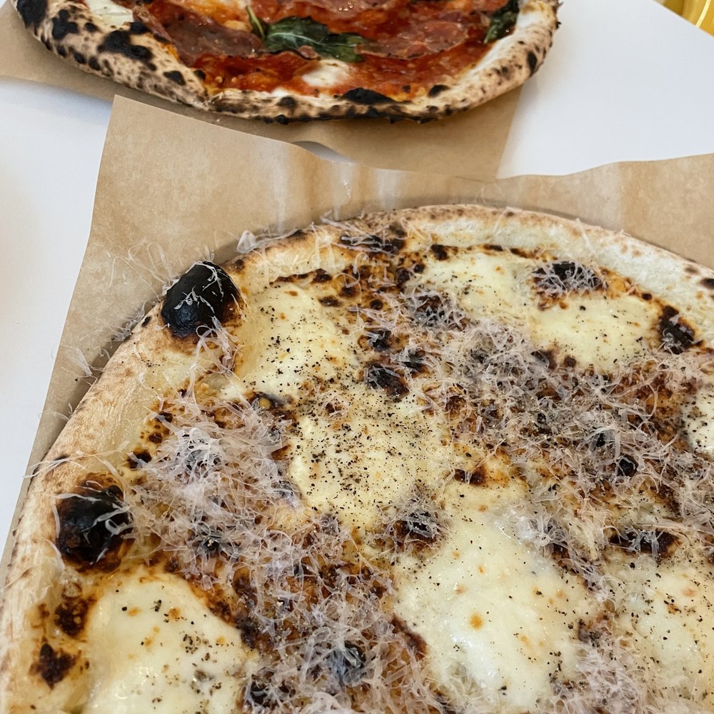 General Assembly Pizza - two pizzas on a table - Pizza Near Me - Toronto, Ontario