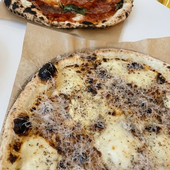General Assembly Pizza - two pizzas on a table - Pizza Near Me - Toronto, Ontario General Assembly Pizza - two pizzas on a table - Pizza Near Me - Toronto, Ontario