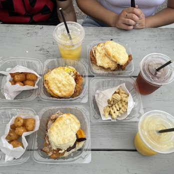 Handsome Biscuit - Top: The Nashville with egg and tots and waffle  Bottom: Hella Fitzgerald with Tots Mimosas in plastic cups - Breakfast & Brunch Near Me - Norfolk, Virginia