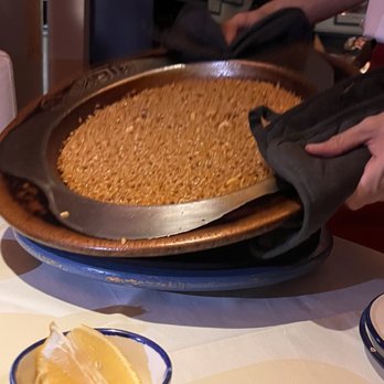 Casa Benigna - The paella: Cooked to perfection in a traditional copper pan, arriving golden, aromatic, and bursting with rich, deep flavor. - Arroceria / Paella Near Me - Madrid, M