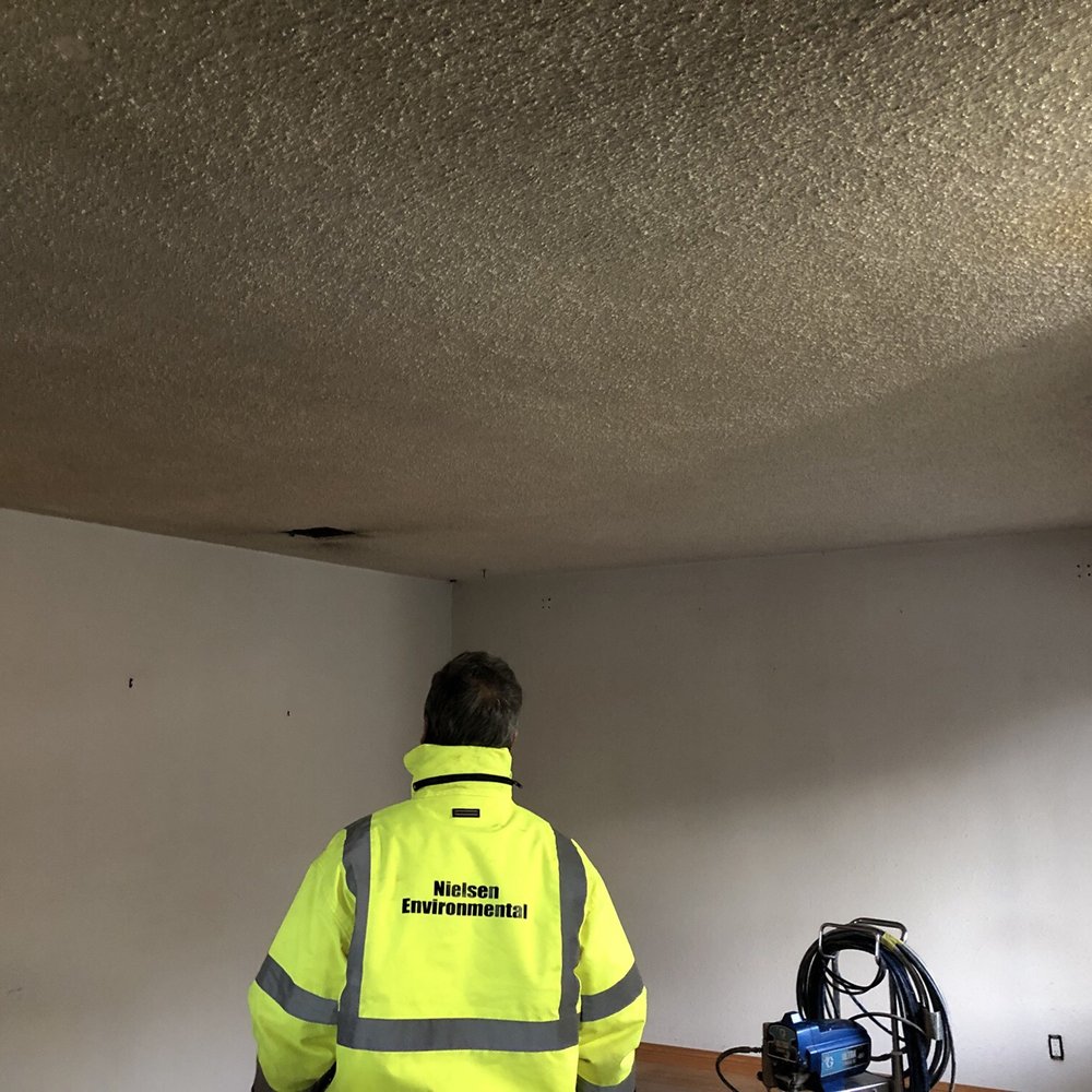 Before - popcorn ceiling in living room. Before - popcorn ceiling in living room.