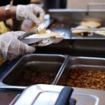 Tacos El Diablito - a woman serving food - Caterers Near Me Tacos El Diablito - a woman serving food - Caterers Near Me