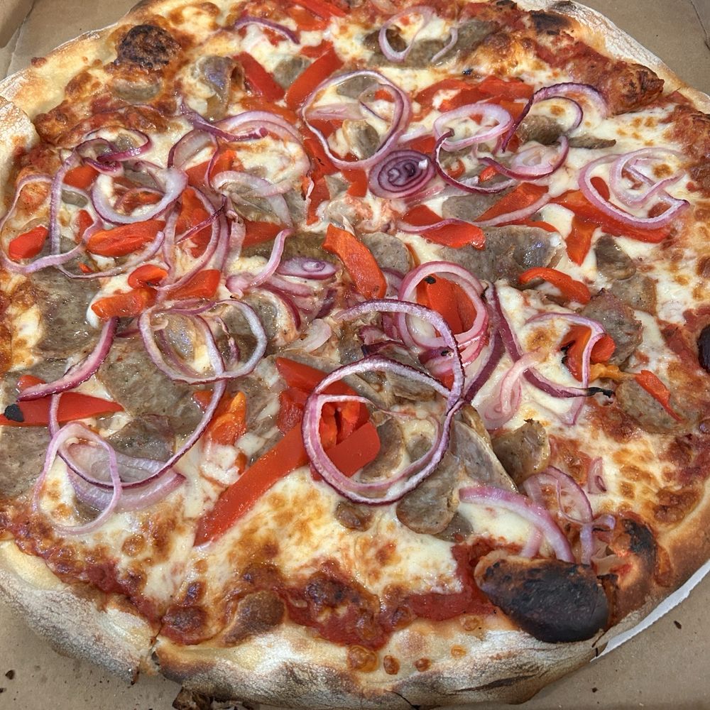 Large Salsiccia Pizza. Perfectly cooked and delicious Large Salsiccia Pizza. Perfectly cooked and delicious