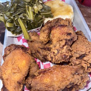 Boricua Soul - Friday special: Pepe fried wings and a biscuit. Collard greens (vegan) were an add on - Soul Food Near Me - Durham, North Carolina