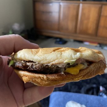 Whataburger - a hand holding a sandwich - Fast Food Near Me - Kerrville, Texas Whataburger - a hand holding a sandwich - Fast Food Near Me - Kerrville, Texas