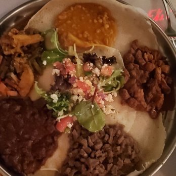 Asmara Restaurant - The combo platter. It gives you lamb, beef, chicken, lentils, vegetables and a salad. Great way to taste the food! - Ethiopian Near Me - Cambridge, Massachusetts