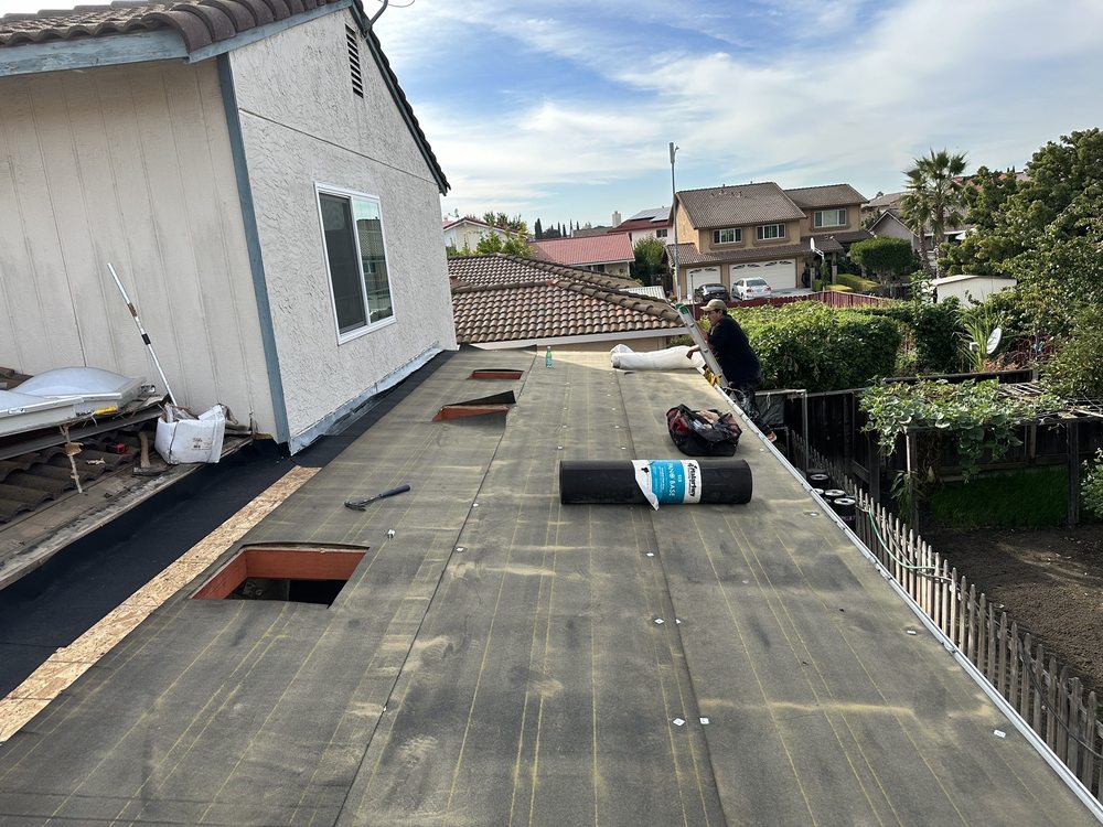 Slide of McGraw and Sons Roofing