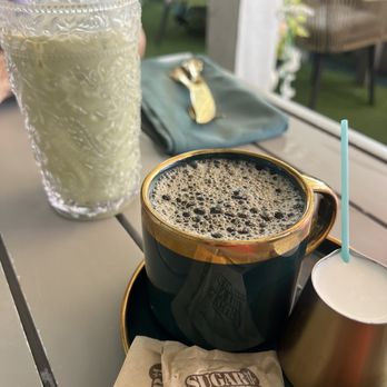 Sugar and Scribe - House coffee & iced matcha with lavender syrup - Bakeries Near Me - La Jolla, California Sugar and Scribe - House coffee & iced matcha with lavender syrup - Bakeries Near Me - La Jolla, California