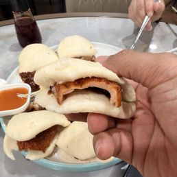 Each bun comes with a slice of duck Each bun comes with a slice of duck