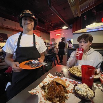 Phil's BBQ - Aryan with the silverware - Barbeque Near Me - San Diego, California