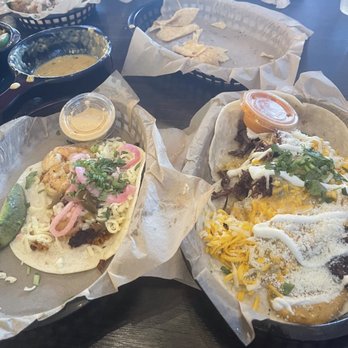 Torchy's Tacos - Naughty Santa (right) ace of spades (left) - Tex-Mex Near Me - Arlington, Texas Torchy's Tacos - Naughty Santa (right) ace of spades (left) - Tex-Mex Near Me - Arlington, Texas