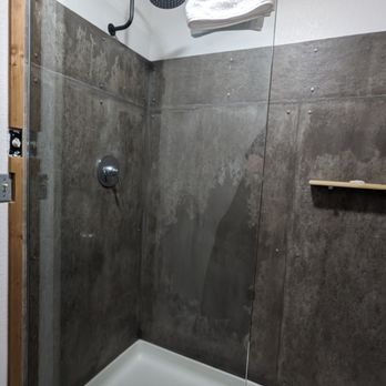 Adrift Hotel - Shower stall with what looks like bare concrete walls (it's not, but it looks like it) - Hotels Near Me - Long Beach, Washington Adrift Hotel - Shower stall with what looks like bare concrete walls (it's not, but it looks like it) - Hotels Near Me - Long Beach, Washington