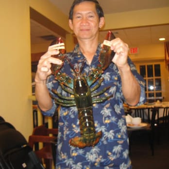 Lobster King - holding the lobster before cooking em - Seafood Near Me - Honolulu, Hawaii Lobster King - holding the lobster before cooking em - Seafood Near Me - Honolulu, Hawaii