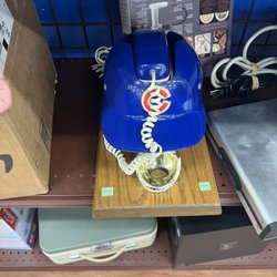 Goodwill - A landline phone in a decorative Chicago Cubs hat housing.