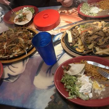 El Tapatio - 2 orders on fajitas for two.  The left side is all steak and the right side is steak and shrimp. - Mexican Near Me - Moab, Utah