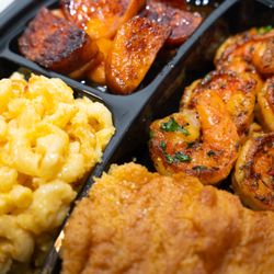 The Corner Boyz - Indulge in 6 succulent shrimp paired with Mac and Cheese, sweet candy yams, and homemade buttery cornbread.