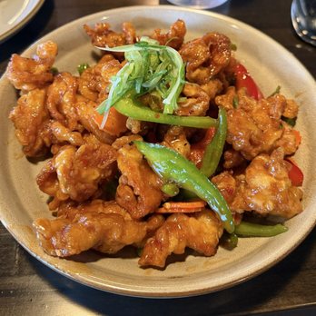 Thai Orchid - GAI TOD battered and fried chicken, glazed in a sweet and spicy sauce with bell pepper, carrot, and peas. Served with rice on the side. - Thai Near Me - Kansas City, Missouri