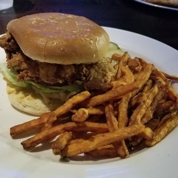 Yard House - Fried chicken sandwich was so delicious! Crispy in the outside, juicy in the inside and not greasy at all. Sweet potato fries were great too - Bars Near Me - Sunrise, Florida Yard House - Fried chicken sandwich was so delicious! Crispy in the outside, juicy in the inside and not greasy at all. Sweet potato fries were great too - Bars Near Me - Sunrise, Florida