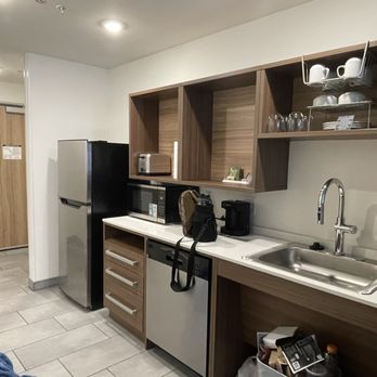Home2 Suites by Hilton Flagstaff - Kitchen area. - Hotels Near Me - Flagstaff, Arizona Home2 Suites by Hilton Flagstaff - Kitchen area. - Hotels Near Me - Flagstaff, Arizona