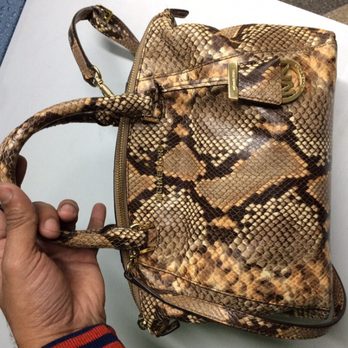 Bandbox Laundry - Examing Python leather bag... - Sewing & Alterations Near Me - Manchester, XGM Bandbox Laundry - Examing Python leather bag... - Sewing & Alterations Near Me - Manchester, XGM
