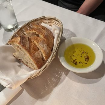 Salvatore Ristorante - House Como bread with a simple yet delicious dipping sauce if really good olive oil flavored with a bit of chili flake & herbs. - Italian Near Me - Seattle, Washington