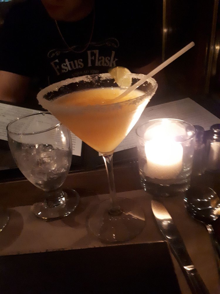 Spago - a person sitting at a table with a drink - drink - Pizza Near Me - Sainte-Adele, Quebec Spago - a person sitting at a table with a drink - drink - Pizza Near Me - Sainte-Adele, Quebec