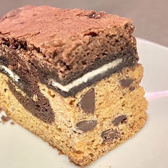 CAKED - Monster Brownie (Slutty). Brownie with an Oreo layer and chocolate chips. This was a little dry as well. - Desserts Near Me - San Diego, California