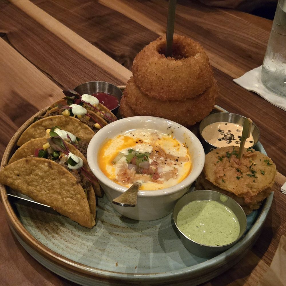 Haywire - 4 app sampler elk tacos, onion rings, queso blanco, fried green tomatoes - New American Near Me - Houston, Texas Haywire - 4 app sampler elk tacos, onion rings, queso blanco, fried green tomatoes - New American Near Me - Houston, Texas