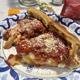 A slice of my Hawaiian and Mediterranean/greek pizza. (I couldn't decide which so I ordered both)