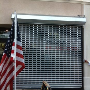 Emergency Gate Repairs - electric grill mesh rolling gate - Fences & Gates Near Me - Queens, New York