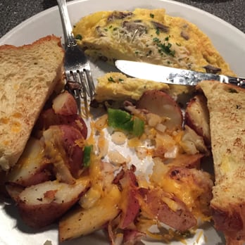 Toast - Portobello Mushroom omelet in progress of eating - Breakfast & Brunch Near Me - Ferndale, Michigan