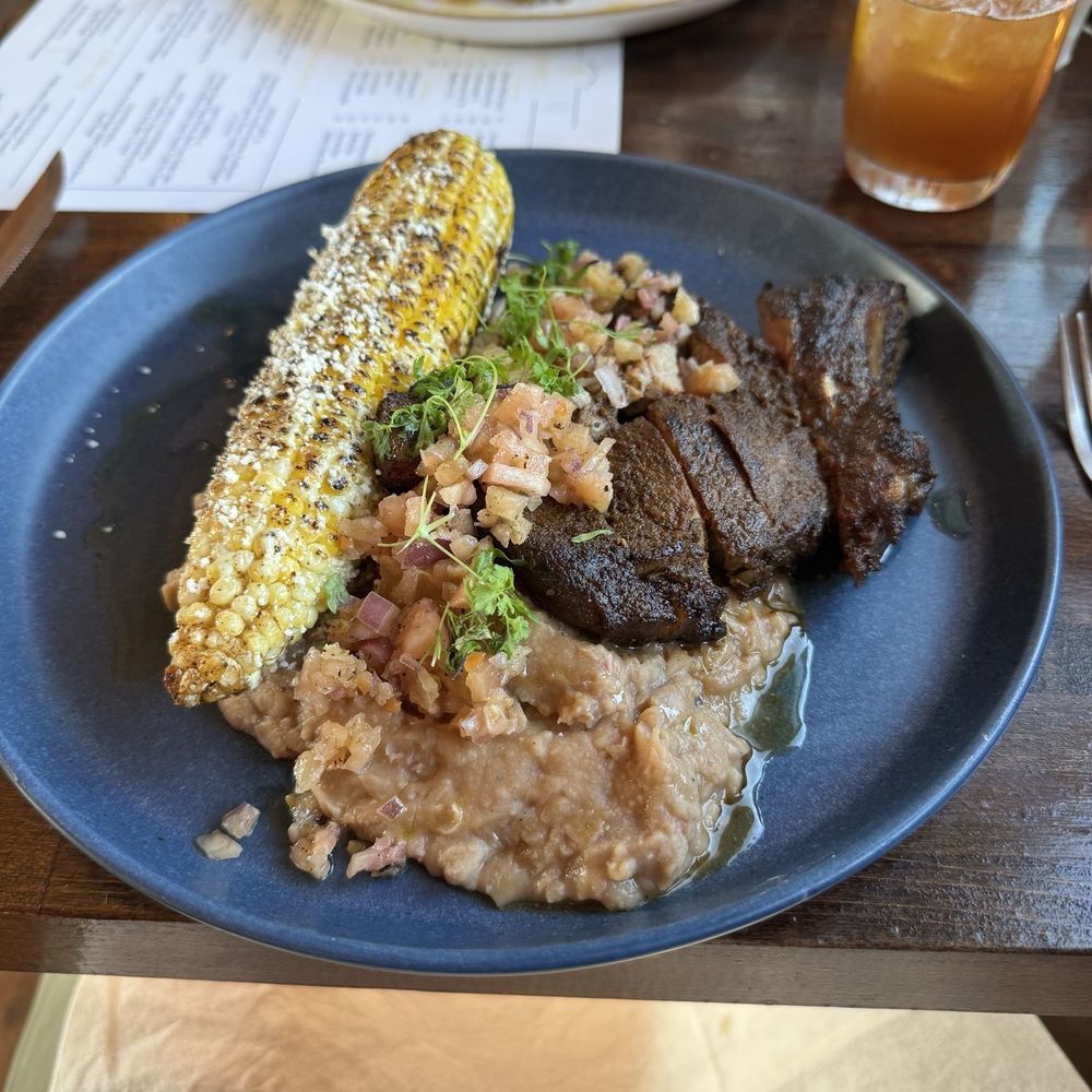 Birria pork chop with beans, corn, and habanero salsa Birria pork chop with beans, corn, and habanero salsa
