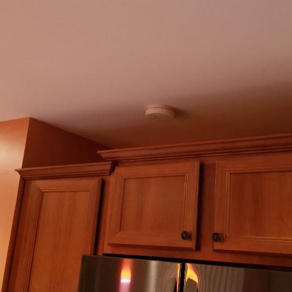 New Phase Contractors - Center cabinets lifted to accommodate larger fridge and detailed molding work to make it look planned. Perfect! - General Contractors Near Me - Wantagh, New York