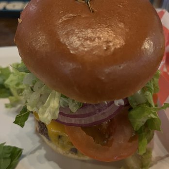The Well & Grill - 14A burger with cheddar cheese as an add-on. - Bars Near Me - Bayonne, New Jersey The Well & Grill - 14A burger with cheddar cheese as an add-on. - Bars Near Me - Bayonne, New Jersey