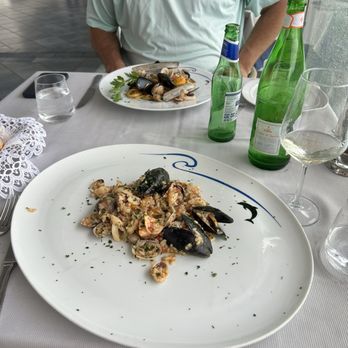 Bagni Delfino - Seafood risotto and scialatielli pasta with seafood - Seafood Near Me - Sorrento, NA Bagni Delfino - Seafood risotto and scialatielli pasta with seafood - Seafood Near Me - Sorrento, NA