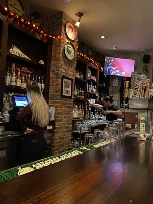 Photo of Kite & Key - Philadelphia, PA, US. a woman behind the bar