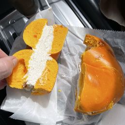 Egg bagel with cream cheese and lox spread.