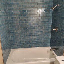 New shower tile and tub with new fixtures. New shower tile and tub with new fixtures.