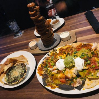 Yard House - Four Cheese Spinach Dip, Chicken Nachos, Onion Ring Tower - New American Near Me - Palmdale, California Yard House - Four Cheese Spinach Dip, Chicken Nachos, Onion Ring Tower - New American Near Me - Palmdale, California