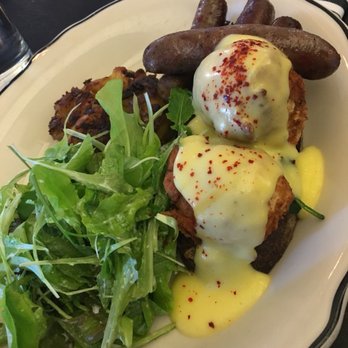 Heritage Tavern - MAPLE LAMB SAUSAGE & SAVORY TOAST: herb French toast, mixed green salad, fried poached eggs, rosti potato, hollandaise - New American Near Me - Madison, Wisconsin
