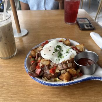 Water Oak Cafe & Bakery - Iced latte, Texas brisket hash w/ egg over medium, blueberry lemonade mocktail - Patisserie/Cake Shop Near Me - Webster, Texas Water Oak Cafe & Bakery - Iced latte, Texas brisket hash w/ egg over medium, blueberry lemonade mocktail - Patisserie/Cake Shop Near Me - Webster, Texas