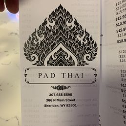 a hand holding a business card