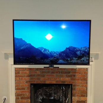 Rtechwork - Pull-down fireplace TV mount installation for better viewing angle above mantle. Professional install by Rtechwork. - Home Theatre Installation Near Me - Grosse Pointe, Michigan Rtechwork - Pull-down fireplace TV mount installation for better viewing angle above mantle. Professional install by Rtechwork. - Home Theatre Installation Near Me - Grosse Pointe, Michigan