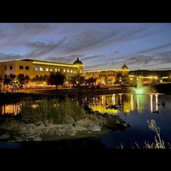 Ambrose Carson River Natural Area - Evening image looking across pond to town square retail stores and restaurants - Parks Near Me - Carson City, Nevada Ambrose Carson River Natural Area - Evening image looking across pond to town square retail stores and restaurants - Parks Near Me - Carson City, Nevada