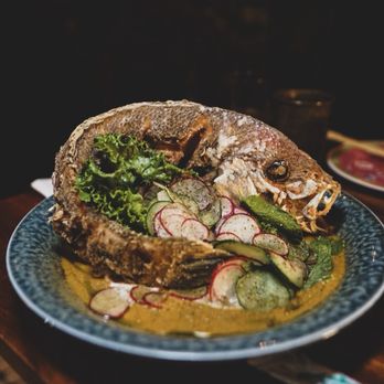 Skull & Crown Trading - Whole Fried Local fish with fresh herbs and Vietnamese curry - Tiki Bars Near Me - Honolulu, Hawaii Skull & Crown Trading - Whole Fried Local fish with fresh herbs and Vietnamese curry - Tiki Bars Near Me - Honolulu, Hawaii