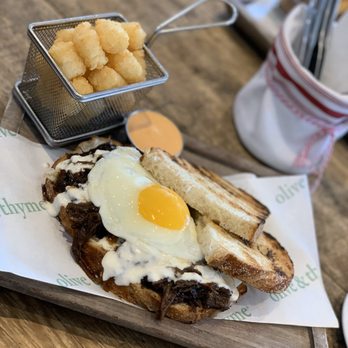 Olive & Thyme - Short rib sandwich with egg and cheese, side of tots - Sandwiches Near Me - Toluca Lake, California Olive & Thyme - Short rib sandwich with egg and cheese, side of tots - Sandwiches Near Me - Toluca Lake, California