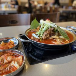 Jomaru Korean Hot Pot - Gam-Ja-Tang and some of the banchan offered.