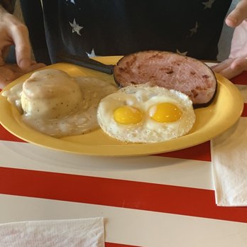 Squeeze In - Eggs over easy (they were cold), ham & biscuit w gravy. Biscuit was too hard he didnt eat it. - American Near Me - Las Vegas, Nevada